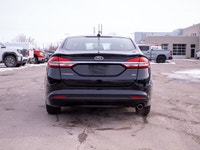 This 2017 Ford Fusion SE is powered by a reliable 2.5L four-cylinder engine paired with a smooth aut... (image 6)