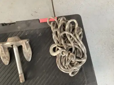 Two boat anchors for Sal as well as a rope with a hook for securing boat 10 lb anchor. $20 5 lb anch...