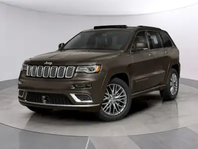 The 2021 Jeep Grand Cherokee Summit in an elegant brown finish is the perfect blend of luxury and ru...