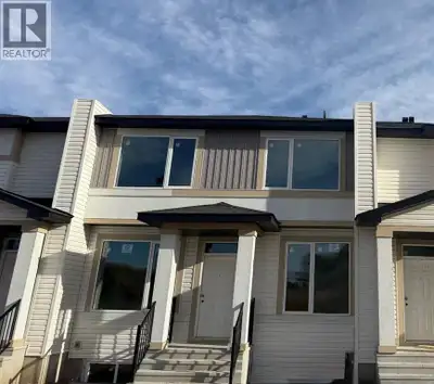 This new construction Triplex Home in the Town of Crossfield AB that is under construction and sched...