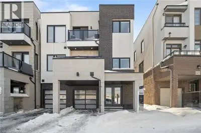 Freehold end-unit townhouse offering three stories of pristine living. This sun-drenched home featur...