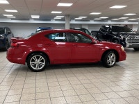 A red 2011 Dodge Avenger SXT easing through the day has a way of making routine driving feel more de... (image 6)