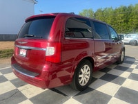 A spacious family minivan with comfortable seating, convenient features, and versatile cargo space,... (image 3)