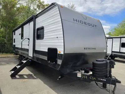 Keystone Hideout travel trailer 262BHS highlights: Front Private Bedroom 20' Power Awning with LED L...
