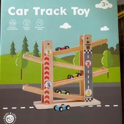 Fun wooden car track toy in excellent used condition with light play wear. Multi-level ramp with cur...