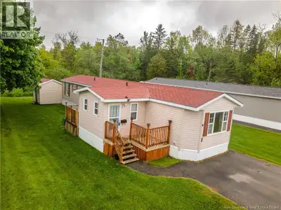 Beautifully maintained mini home offering comfortable one-level living. This home features two good...