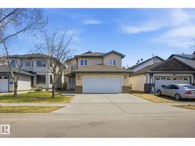 ~ 4 BEDROOM BI-LEVEL ~ 3 FULL BATHS ~ OVERSIZED HEATED DOUBLE ATTACHED GARAGE 22' x 29.5' ~ CENTRAL...