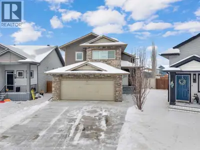 Show-home quality meets everyday livability in the heart of MacKenzie Ranch. Set on a generous pie-s...