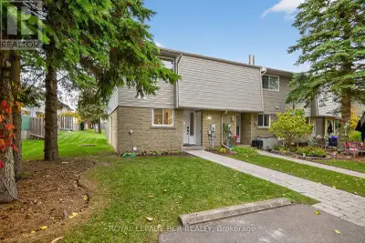 Welcome to this beautifully updated 3 bedroom + main floor den, 2 bathroom, end unit condo townhouse...