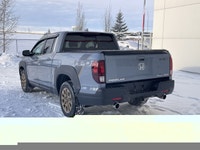 Our 2023 Honda Ridgeline Touring in Sonic Grey with the Honda Performance Development Package is in... (image 7)