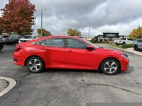 The 2021 Honda Civic Sedan LX in vibrant Rallye Red is your reliable and stylish companion for daily... (image 3)