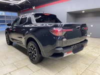 The 2023 Hyundai Santa Cruz Preferred AWD in sleek black offers an extraordinary driving experience... (image 5)