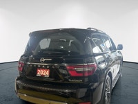 Experience luxury and power in the 2024 Nissan Armada 4x4 Platinum, presented in an eye-catching Bla... (image 4)