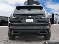 Command the urban landscape with the striking 2025 Cadillac XT4 AWD Sport, featuring the distinctive... (image 4)