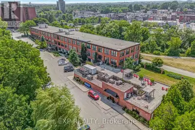 Experience sophisticated urban living at 543 Timothy Street Unit 111, a charming loft condominium ne...