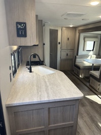 The popular 243RBS is the ideal couple’s coach! This floorplan boasts a full-size super slide with b... (image 8)