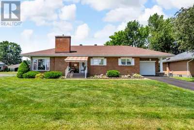 Welcome to this immaculate all-brick bungalow, ideally situated on a spacious corner lot in the hear...