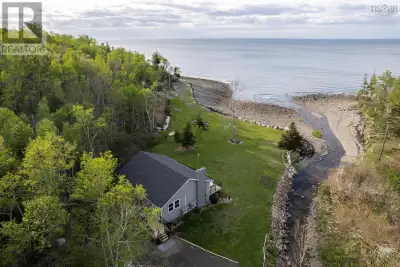 Nestled on 16 acres with direct Bay of Fundy shore frontage, this hidden gem offers exceptional priv...