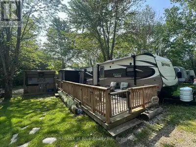 Your Ideal Summer Getaway Awaits!Escape to nature with this spacious, well-treed lot featuring a uni...