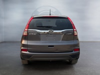 Experience year-round confidence and everyday versatility in this 2016 Honda CR-V LX AWD. Powered by... (image 5)
