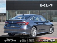 The 2022 Honda Civic Sedan EX, a striking grey 4-door car with a comfortable black interior, redefin... (image 5)