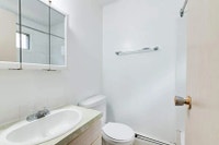 Amenities: Storage Room • Security Lights • Affordable Parking Suite & Building: Bachelor suites Spa... (image 5)