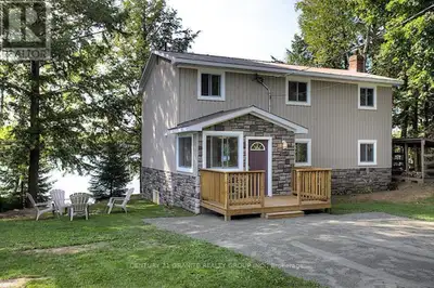 Paudash Lake 4 season cottage 4 bedroom, open concept 2 story spacious cottage. Multi-level decks on...
