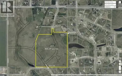 An exceptional & rare development or holding opportunity in central Springbank within the Grandview...