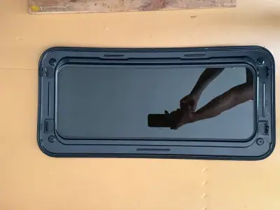 Great condition sunroof off of a 2008 Mazda 3 GT no rust. ($80) Also selling blue driver side mirror...