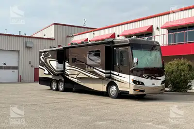 This meticulously maintained 2014 Newmar Ventana 4037 on a Freightliner Custom Chassis with tag axle...