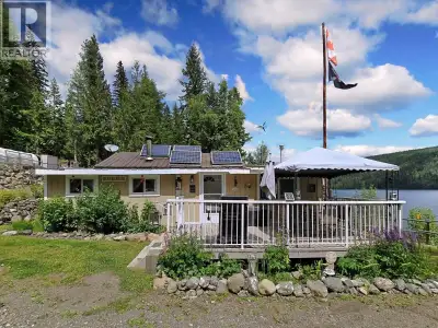 Rarely available 10-acre private retreat with 303ft waterfront on spectacular Quesnel Lake! This tho...