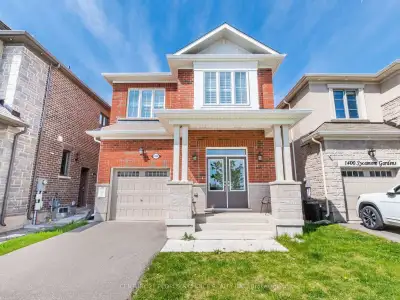 Welcome to this Beautiful Pond Facing 1974 sq.ft Detached House in Cobban Community! A Separate Side...