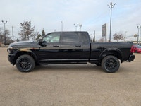 The 2026 Ram 2500 Limited Mega Cab Night Edition in Diamond Black Crystal Pearl delivers bold stylin... (image 2)