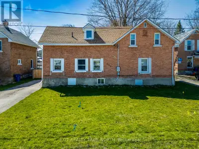 Welcome to this charming century home with a modern touch! This 4-bedroom, 2-bathroom residence boas...