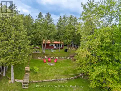 Discover this charming 3-season log cottage situated on a beautiful double waterfront lot with appro...