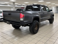 Among midsize pickups that talk tough but feel soft when the work gets real, this 2021 Toyota Tacoma... (image 5)