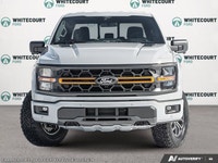Introducing the 2026 Ford F-150 Tremor, dressed in a stunning white exterior and equipped with a rob... (image 2)