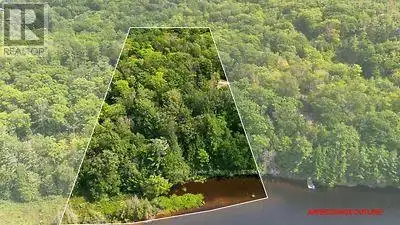 3.64 wooded acres and approximately 330 feet of waterfront on the Seguin River, all within the Town...