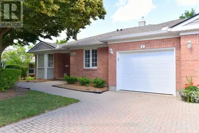 FANTASTIC END UNIT BUNGALOW IN RIVERWALK BACKING ONTO THE GRAND RIVER!! This bright and spacious Bun...