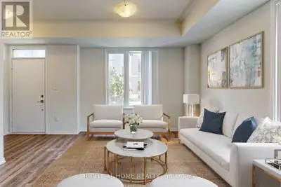 Welcome to this stunning 1,608 sq. ft. contemporary end-unit townhouse, where style, space, and loca...