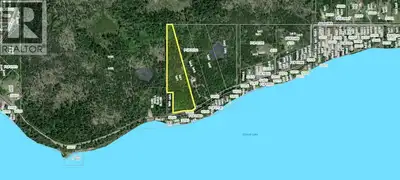 Escape to the outdoors and enjoy this beautiful 9.84-acre treed property near Cluculz Lake, ideally...