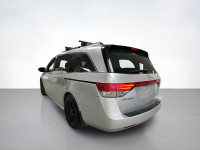Our used family-friendly 2014 Honda Odyssey Touring is shown in stunning Alabaster Silver Metallic.... (image 2)