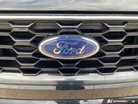 The 2024 Ford Escape ST-Line in sleek black boasts AWD capabilities, making it a versatile and relia... (image 8)