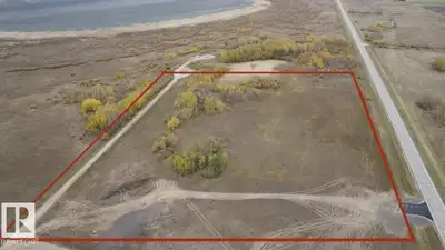 Beautiful 11-acre parcel perfectly positioned on RR 221 on Leduc County, backing onto Joseph Lake an...