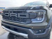 The 2024 Ford Ranger Raptor, finished in Shelter Green with refined Ebony leather-trimmed seats, is... (image 2)