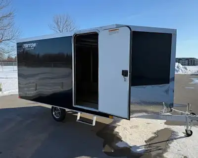 8.5x12 trailer. V-nose design, with side door and ramp door. Slide track with adjustable tie down lo...