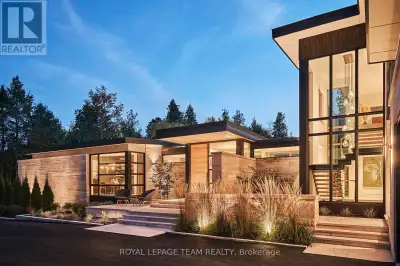 Discover a rare opportunity to own an architectural dream in the Kanata Rockeries. This ultra-privat...
