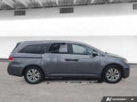 Experience the comfort and practicality of this pre-owned minivan, finished in elegant Alabaster Gre... (image 5)