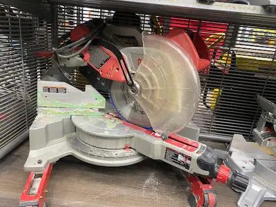 Milwaukee Tool 12-inch Dual Bevel Sliding Compound Mitre Saw Item# 1418552 Some signs of normal use,...