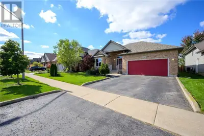Nestled in the sought-after community of custom homes in Smithville, this beautiful bungalow offers...